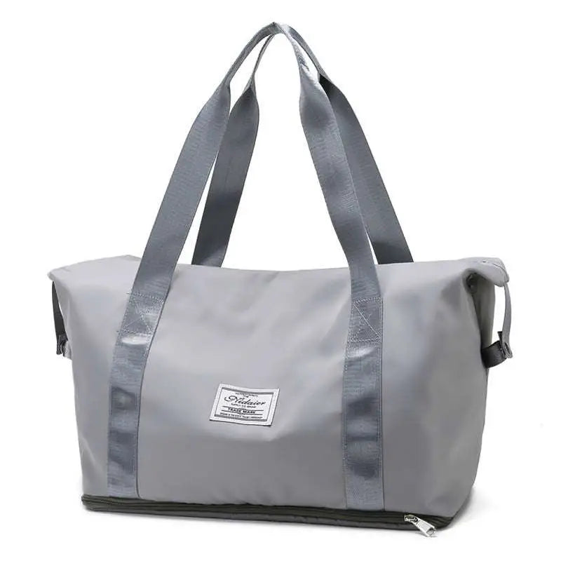 Gray duffel bag with reinforced handles and branded patch front designed for maroon wet separation sports use