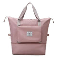A soft pink maroon wet separation sports bag with gray handles and a front pocket featuring a label designed for travel