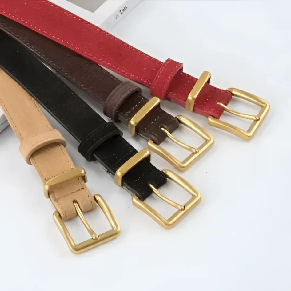 Four slim women’s suede leather belts in red brown black and tan with gold-tone buckles including matcha green style