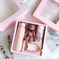 Matte pink vacuum flask with a gold lid and carrying loop in a corporate gift box suitable for aromatherapy tablets