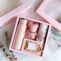 Matte pink vacuum flask with a gold lid and carrying loop in a corporate gift box ideal for aromatherapy tablets