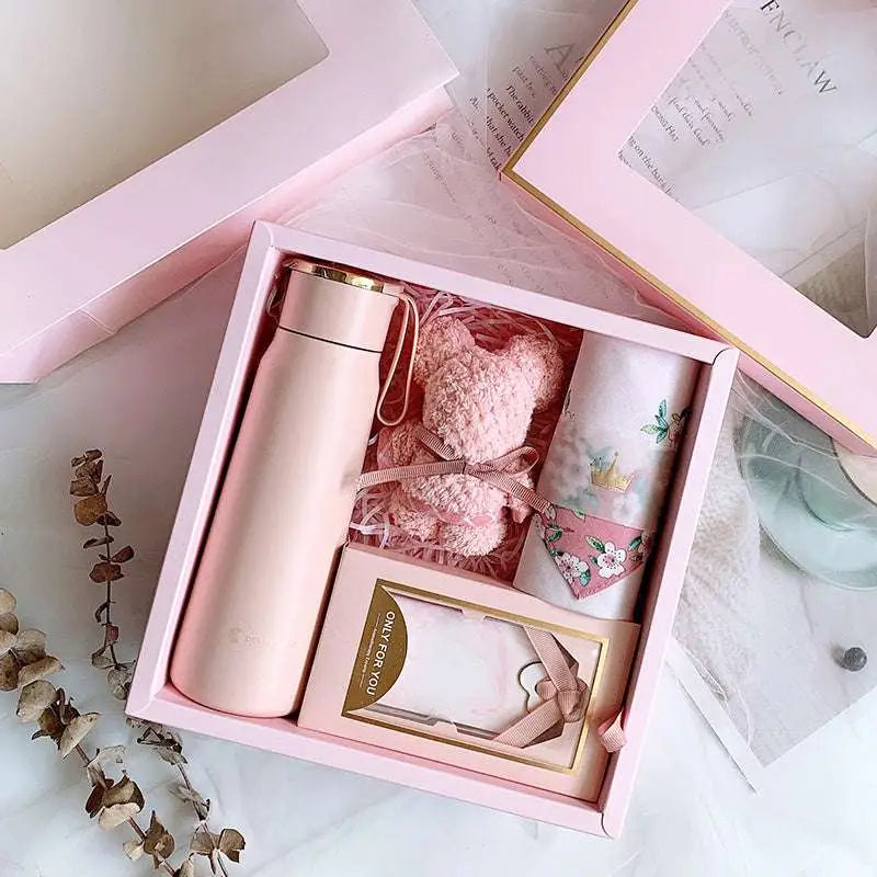 Matte pink vacuum flask with a gold lid and carrying loop in a corporate gift box ideal for aromatherapy tablets