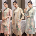 Medium length cheongsam floral dress set in pastel colors with matching jackets and teal frog closures accessories
