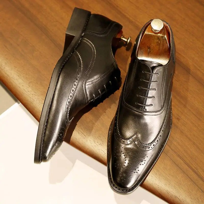 Black leather shoes with polished finish and decorative perforations rubber sole brogues for men