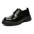 Men’s casual black patent leather oxford shoe with glossy finish, red stitching, and chunky textured rubber sole