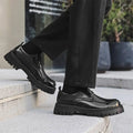 Black patent leather men’s casual lace-up oxford shoes with glossy finish red stitching and chunky textured sole