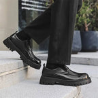 Black patent leather men’s casual lace-up oxford shoes with glossy finish red stitching and chunky textured sole