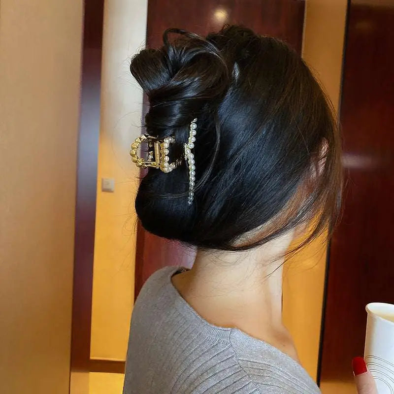 Mermaid gold shark clip featuring gold-toned metal, sparkling rhinestones, and white pearls for korean elegant temperament