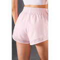 Pink mesh pockets fitness shorts with elastic waistband and breathable mesh trim in two-piece athletic set