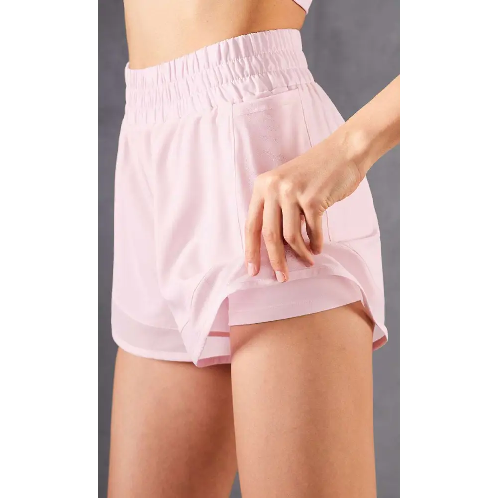 Light pink two-layered mesh pockets fitness shorts with elastic waistband and side pocket in breathable two-piece athletic set