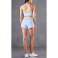 Light blue mesh pockets fitness two-piece athletic set with breathable crop top and high-waisted shorts back view