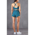 Teal mesh pockets fitness two-piece athletic set with strappy back bra top and high-waisted breathable fitness pants