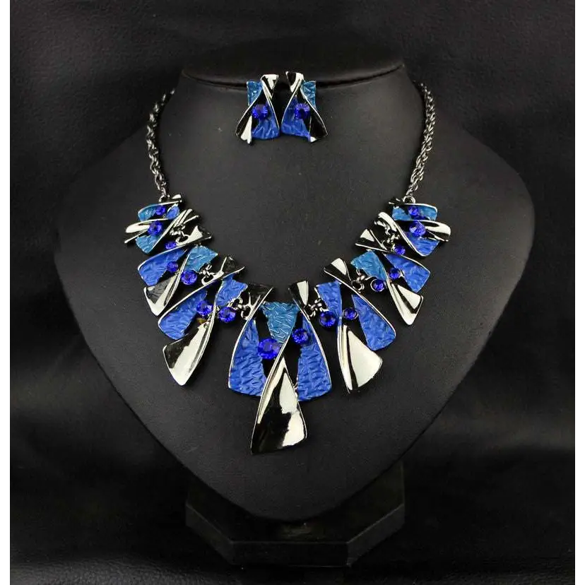 Blue and silver metal geometric shape rhinestone necklace set with textured layered pieces and small blue bead accents