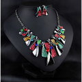 Vibrant metal geometric shape necklace set with multicolored enamel and rhinestone accents featuring choker design