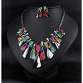 Vibrant metal geometric shape necklace set with colorful enamel panels and sparkling shape rhinestone earrings in silver chains