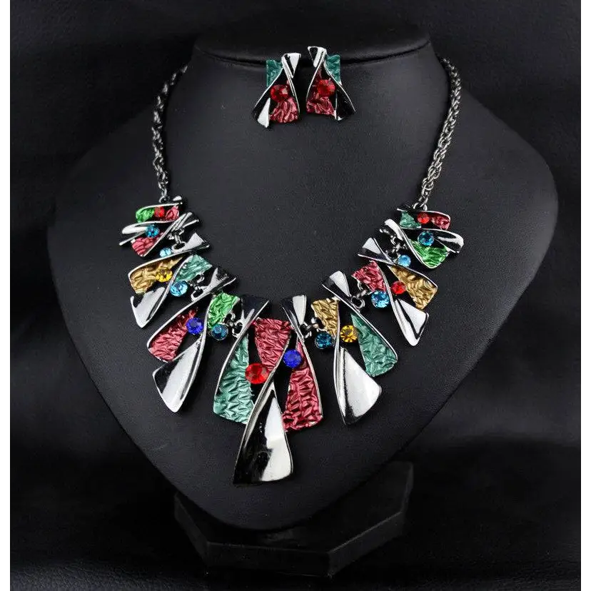 Vibrant metal geometric shape necklace set with colorful enamel panels and sparkling shape rhinestone earrings in silver chains