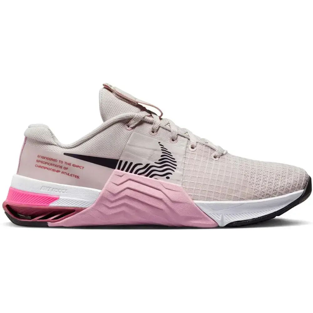 pink and gray nike metcon workout shoe with mesh upper black swoosh logo and textured midsole featured on royalessencelux titanium steel jewelry and collection highlights page