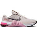 Pink and beige nike metcon 5 sneakers barely rose with mesh upper black swoosh and cushioned midsole in rose cave purple