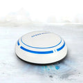 White and blue circular mini desktop robot vacuum with sleek modern design for efficient desktop cleaning