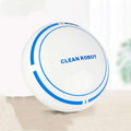 Mini desktop robot vacuum cleaner in white with blue accents and clean robot branding for desktop cleaning