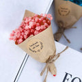 Mini dried flower bouquet gift box featuring delicate pink dried baby’s breath wrapped in kraft paper for home decoration