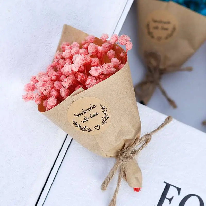 Mini dried flower bouquet gift box featuring delicate pink dried baby’s breath wrapped in kraft paper for home decoration