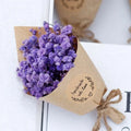 A mini dried flower bouquet gift box featuring a delicate lavender bouquet wrapped in rustic kraft paper with twine