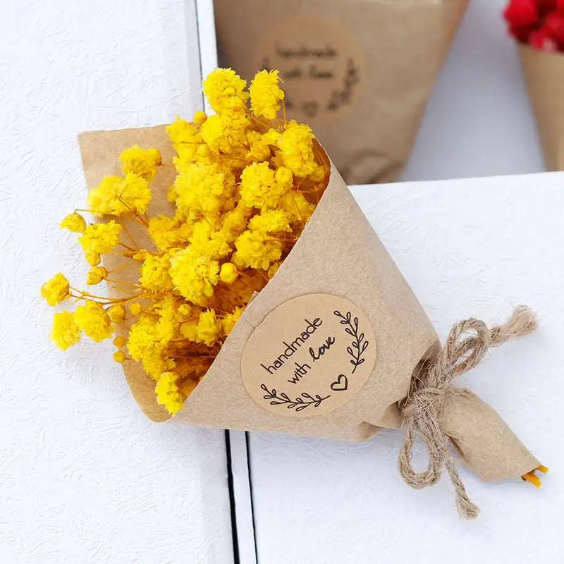 A vibrant yellow dried flower bouquet wrapped in rustic kraft paper tied with twine for home decoration bouquet gift box