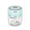 Mini electric garlic chopper with a clear glass bowl, stainless steel blade, and mint green and gray design