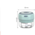 A compact mint-green mini electric garlic chopper with stainless steel blade and clear glass bowl for efficient chopping