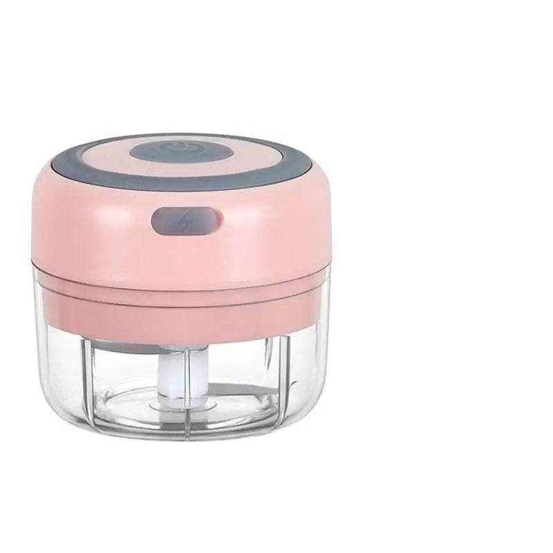 Mini electric garlic chopper with pink and gray design, clear glass bowl, and stainless steel blade for efficient chopping
