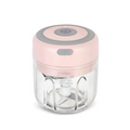 Pink and gray mini electric garlic chopper with clear glass bowl and stainless steel blade for efficient food chopping
