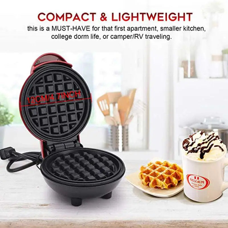 Mini electric waffle maker in red and black with non-stick cooking surface for easy waffle preparation and 7-inch size