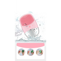 Mini silicone electric facial cleanser brush with pink and silver dual-tone body and soft silicone bristles for gentle cleansing