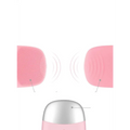 Pink mini silicone electric facial cleanser brush with soft silicone bristles and a silver metallic base