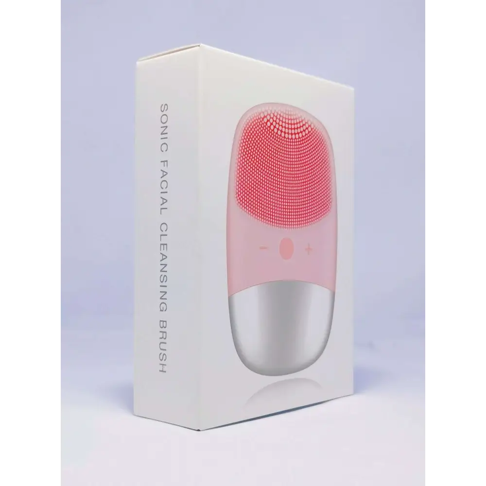 Mini silicone electric facial cleanser brush with pink and silver body and soft silicone bristles for gentle cleansing
