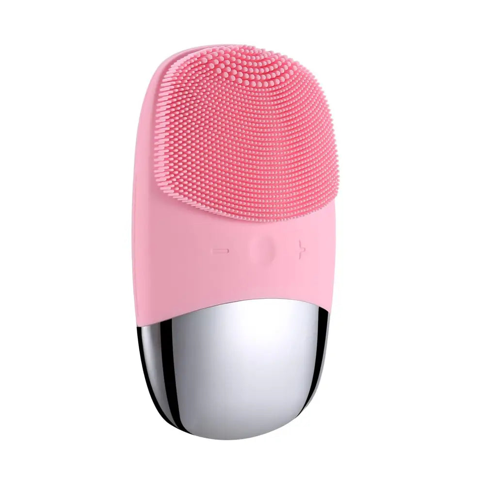Mini silicone electric facial cleanser brush with pink and silver design and soft silicone bristles for gentle cleansing