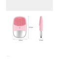 Mini silicone electric facial cleanser brush in pink and silver with soft silicone bristles for gentle cleansing