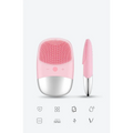 Mini silicone electric facial cleanser brush with pink and silver body and soft silicone bristles for gentle cleansing