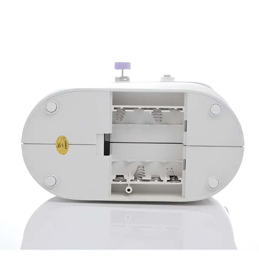 White oval miniature household multifunctional sewing machine with hinged lid and internal compartments for springs and parts