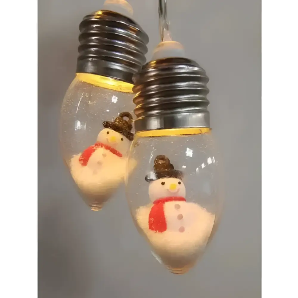 Clear glass miniature scene christmas led string lights with silver bases and snowman figurines in decorative lights