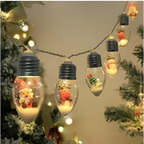Clear glass miniature scene christmas led string decorative lights with black caps featuring festive figures on white sand
