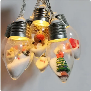 Miniature scene christmas led string decorative lights with clear glass bulbs featuring snow and festive figurines