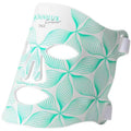 White omnilux contour face mask with teal leaf pattern for minilux collagen anti aging beauty instrument use