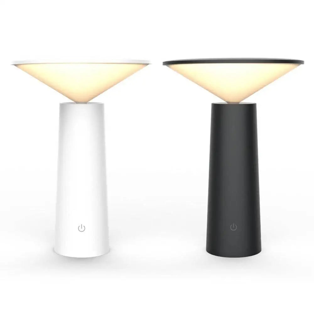 Two minimalist touch table lamps with sleek cylindrical bases and usb led softly glowing shades in black and white