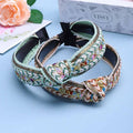 Two intricately woven mint green knotted hair accessories with gold thread accents hair accessories bohemian style