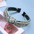 Mint green knotted hair accessories bohemian woven headband with braided design, rhinestones, gold accents, and black satin bow