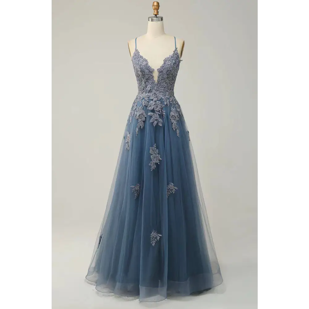 A delicate mint green lace women evening dress with floral embroidery, thin straps, and a flowing tulle skirt with slit