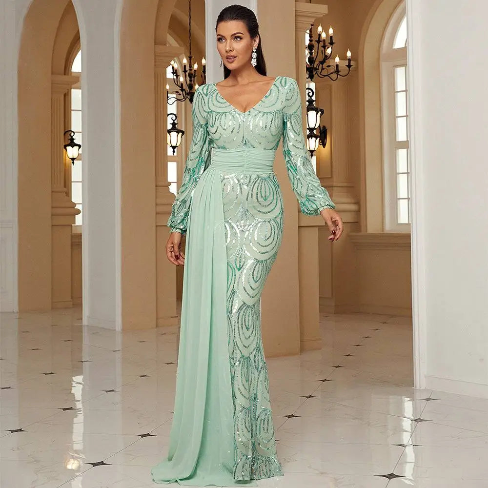 A shimmering mint green long sleeve sexy sequined evening dress with a fitted silhouette and intricate sequin patterns