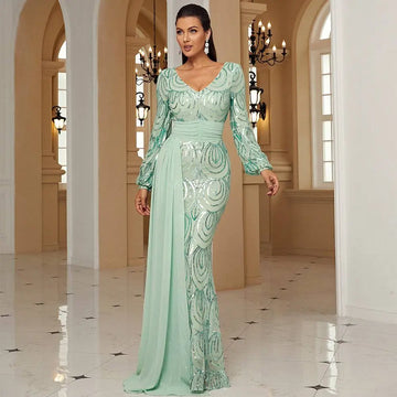 A shimmering mint green long sleeve sexy sequined evening dress with a fitted silhouette and intricate sequin patterns